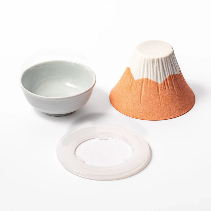 Orange Mount Fuji ceramic coffee filter with snowy peak handcrafted in Japan for modern pour over brewing.