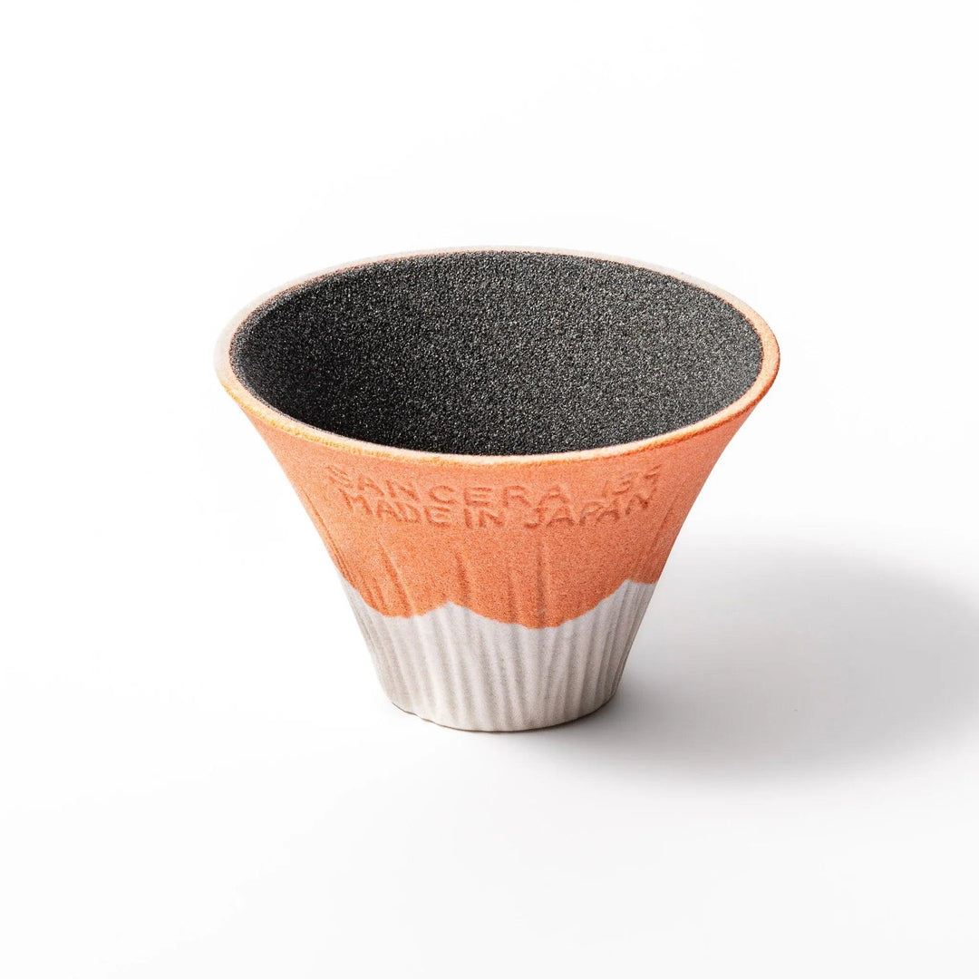Orange Mount Fuji ceramic coffee filter with snowy peak handcrafted in Japan for modern pour over brewing.