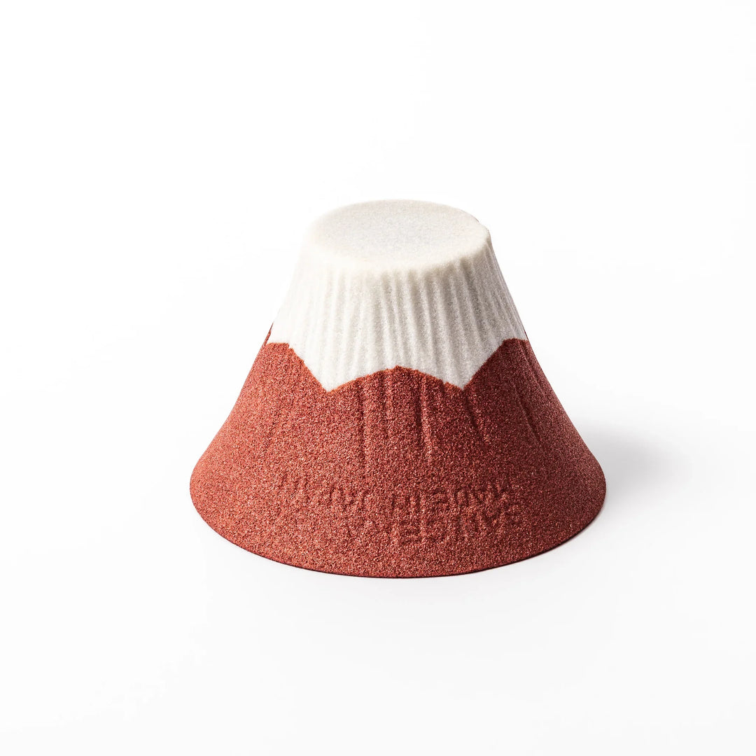 Red and white Mount Fuji ceramic coffee filter handcrafted in Japan for sustainable brewing and decor.
