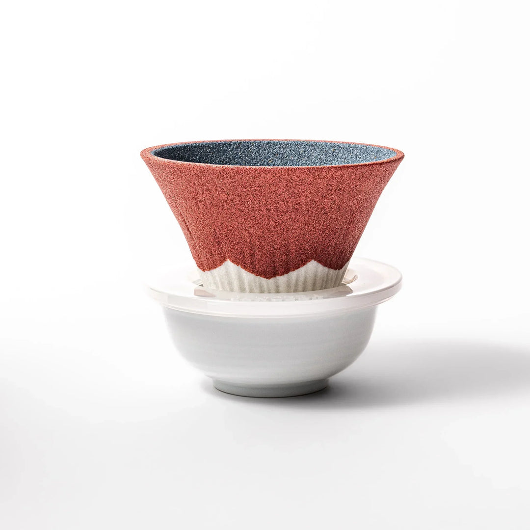 Red and white Mount Fuji ceramic coffee filter handcrafted in Japan for sustainable brewing and decor.
