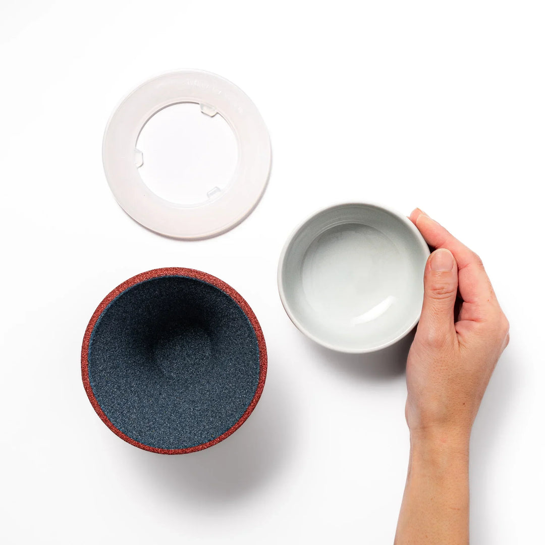 Red and white Mount Fuji ceramic coffee filter handcrafted in Japan for sustainable brewing and decor.