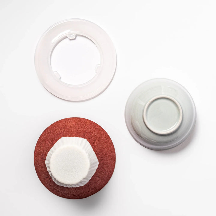 Red and white Mount Fuji ceramic coffee filter handcrafted in Japan for sustainable brewing and decor.