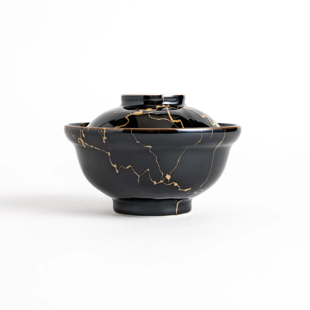 Black ceramic donburi bowl with gold marbled design and matching lid perfect for serving Japanese rice dishes.