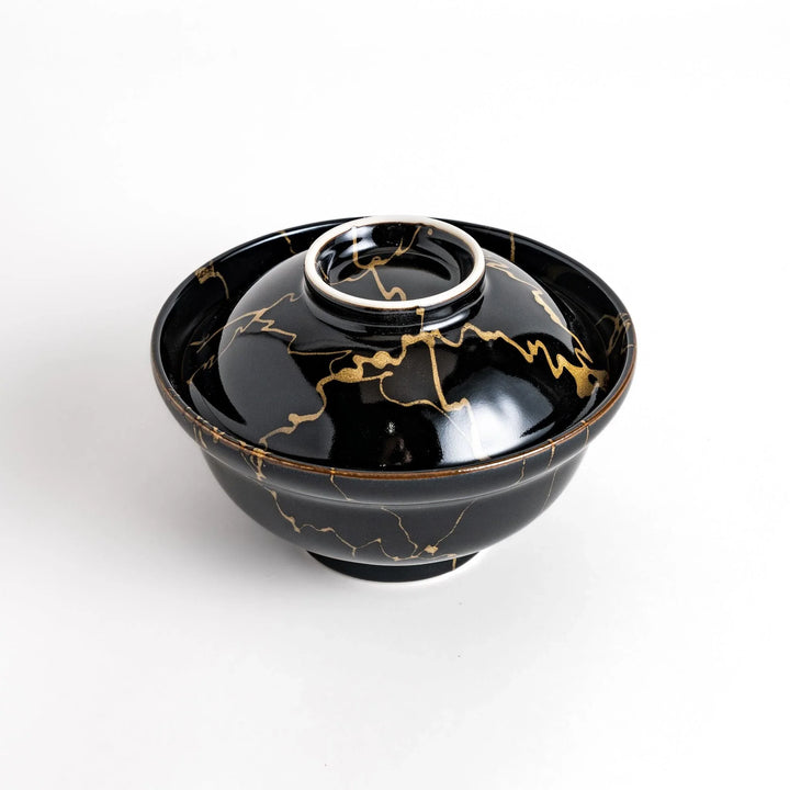 Black ceramic donburi bowl with gold marbled design and matching lid perfect for serving Japanese rice dishes.