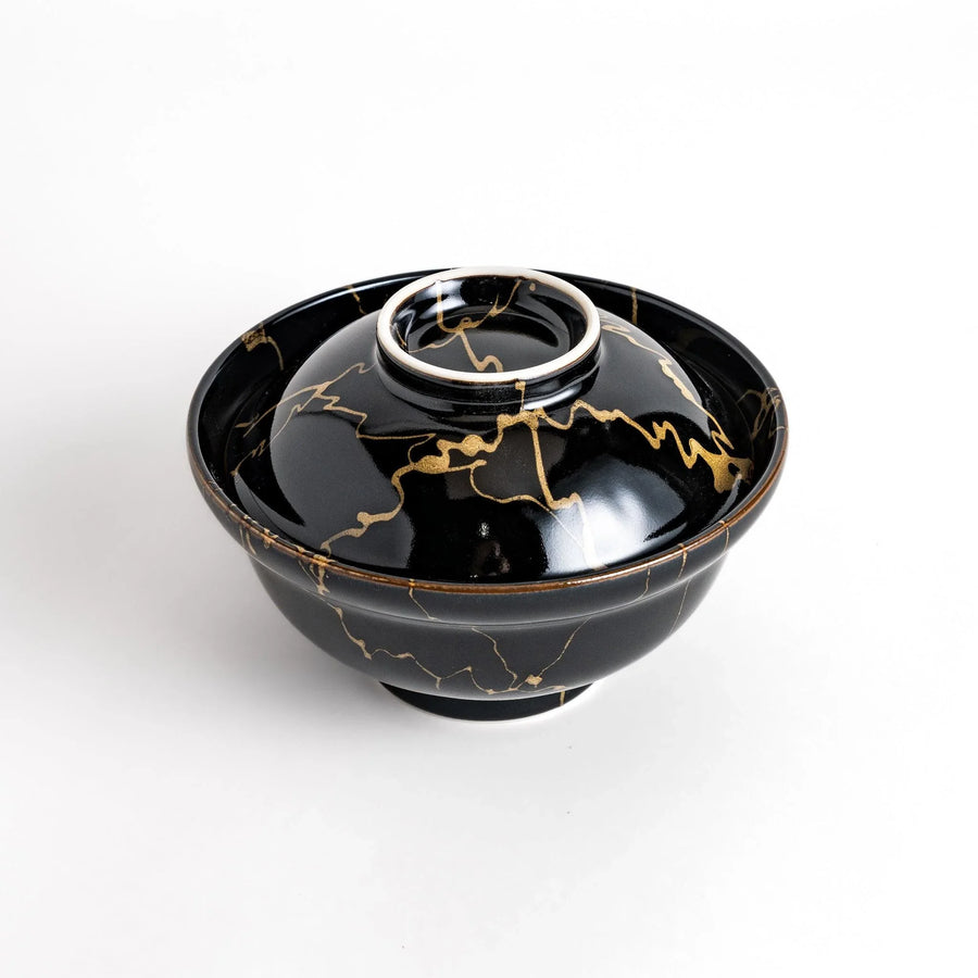 Black ceramic donburi bowl with gold marbled design and matching lid perfect for serving Japanese rice dishes.