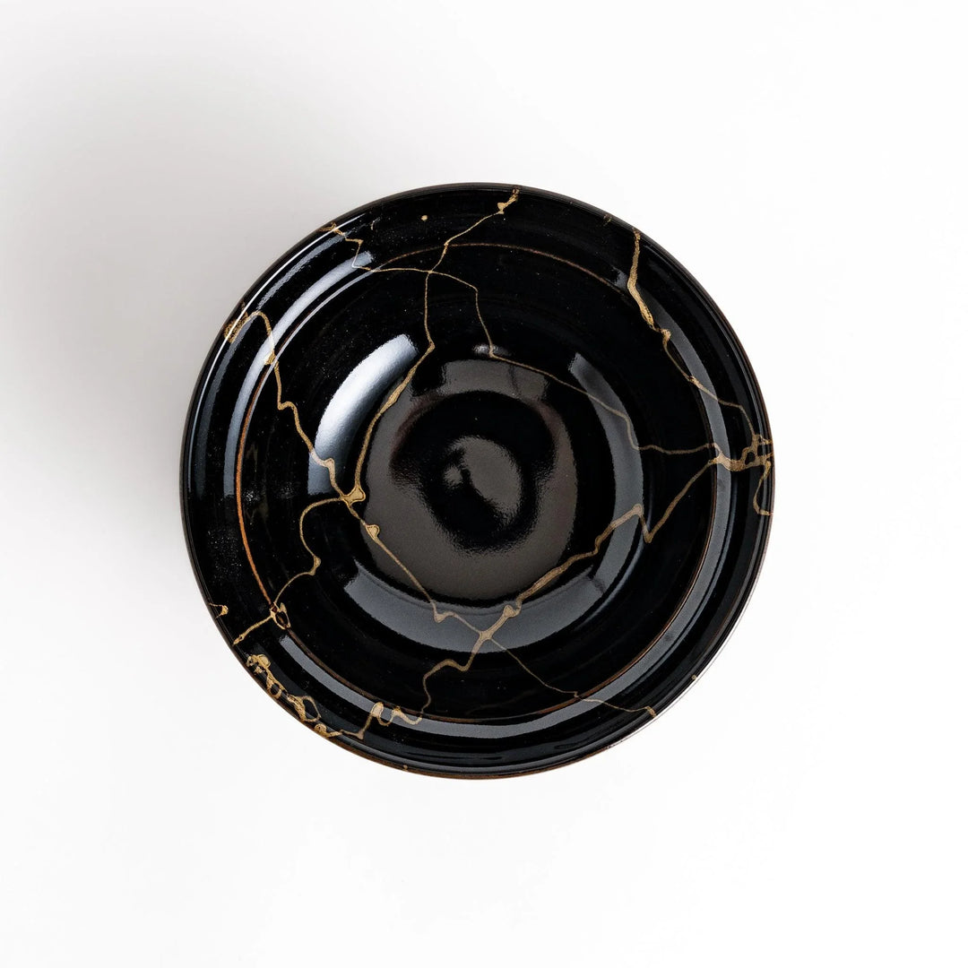 Black ceramic donburi bowl with gold marbled design and matching lid perfect for serving Japanese rice dishes.