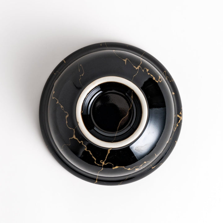 Black ceramic donburi bowl with gold marbled design and matching lid perfect for serving Japanese rice dishes.