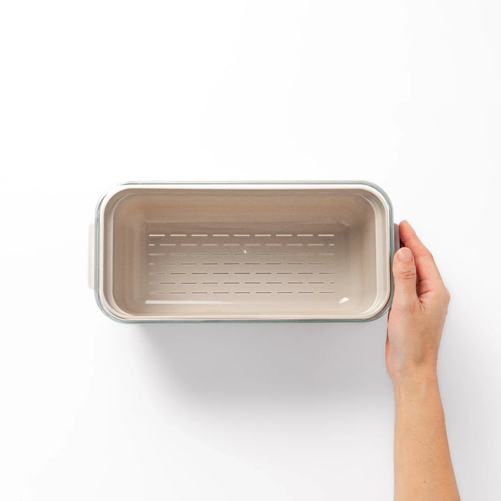 Japanese nukazuke fermentation box with clear lid and black rice paddle for home pickling and storage.