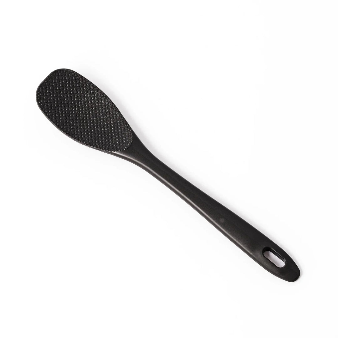 Black mixing spatula with textured surface designed for stirring and maintaining Japanese nukazuke fermentation.