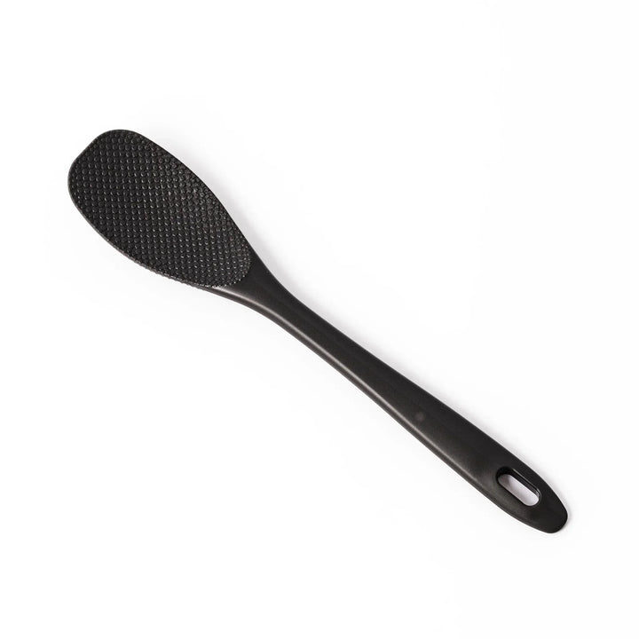 Black mixing spatula with textured surface designed for stirring and maintaining Japanese nukazuke fermentation.