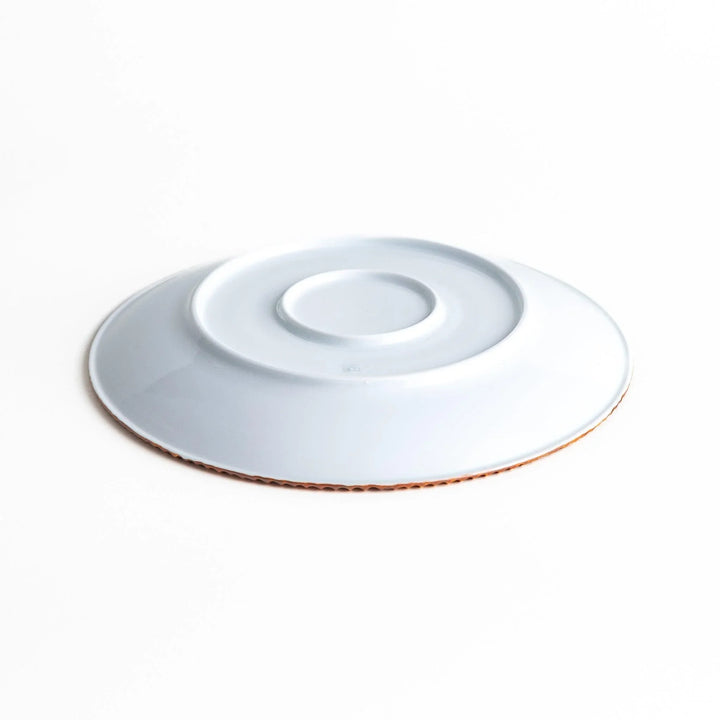 A round white dinner plate with a rustic scallop-edged border. The border comes in blue, brown, and olive.