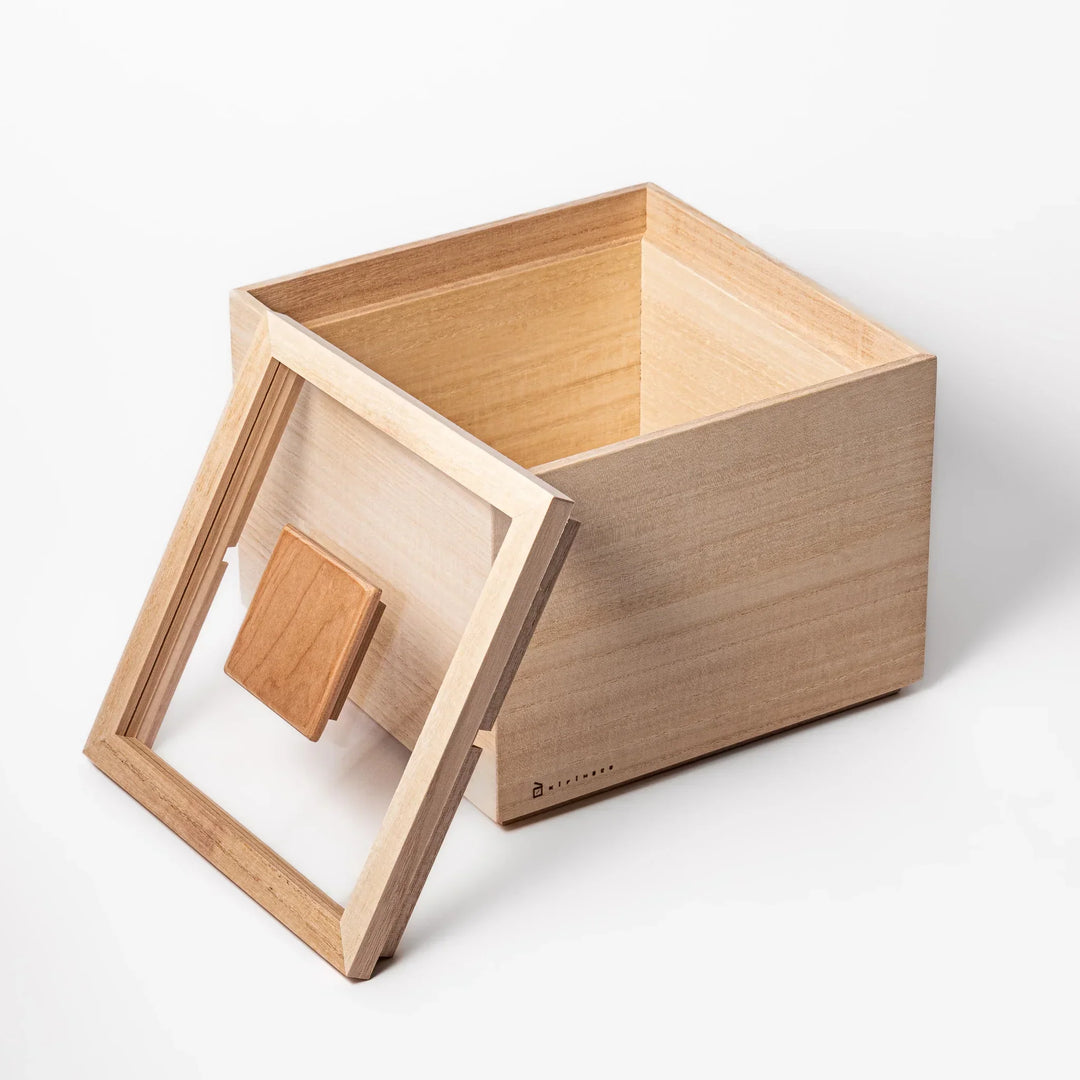 Paulownia wood rice container with airtight lid, handcrafted in Japan to keep rice fresh, lightweight, and naturally moisture-resistant.