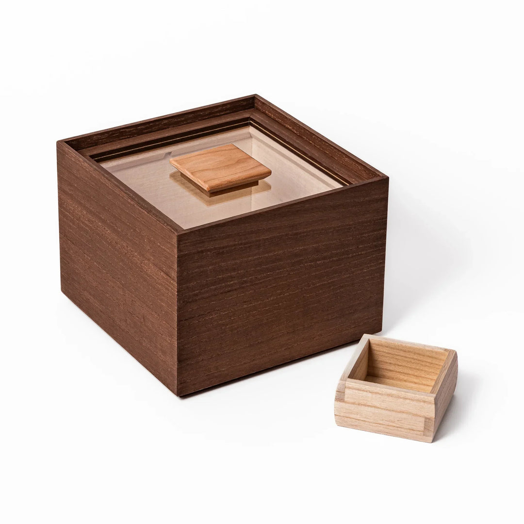 Dark brown paulownia wood rice container with airtight lid handcrafted in Japan for storing up to 3 kg rice.