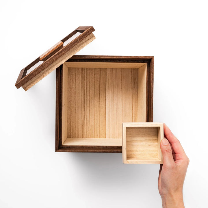 Dark brown paulownia wood rice container with airtight lid handcrafted in Japan for storing up to 3 kg rice.