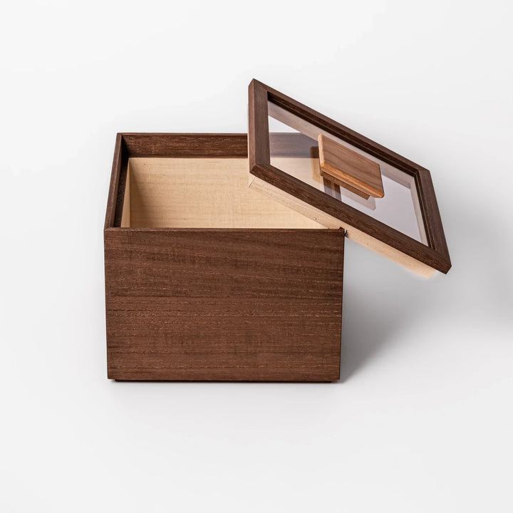 Dark brown paulownia wood rice container with airtight lid handcrafted in Japan for storing up to 3 kg rice.