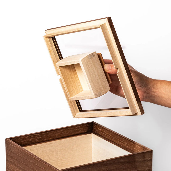 Dark brown paulownia wood rice container with airtight lid handcrafted in Japan for storing up to 3 kg rice.