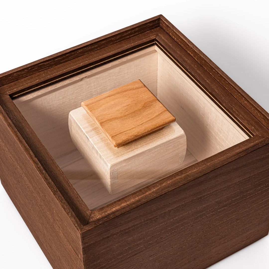 Dark brown paulownia wood rice container with airtight lid handcrafted in Japan for storing up to 3 kg rice.