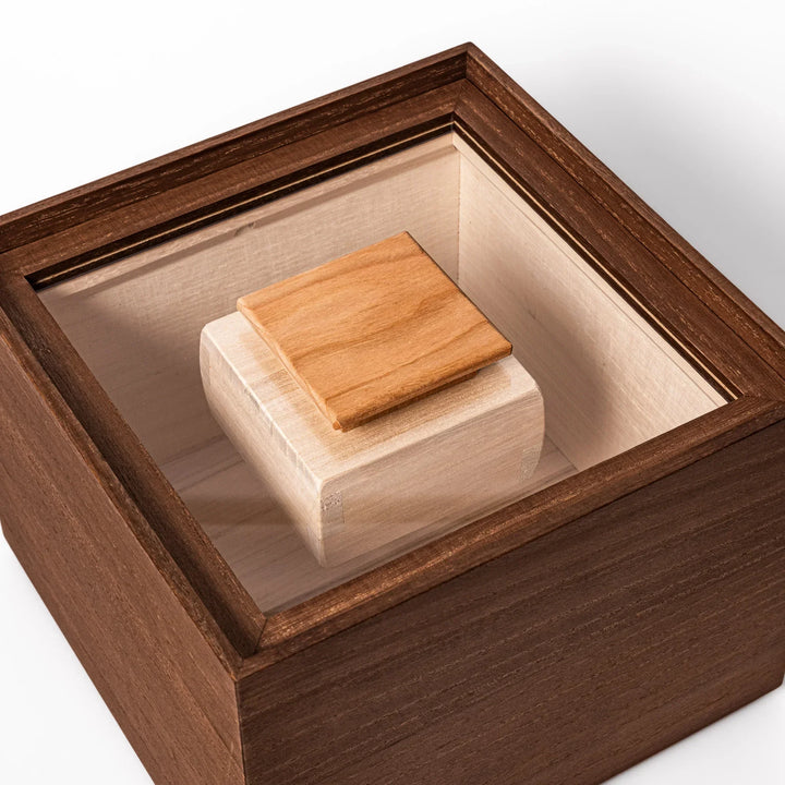 Dark brown paulownia wood rice container with airtight lid handcrafted in Japan for storing up to 3 kg rice.
