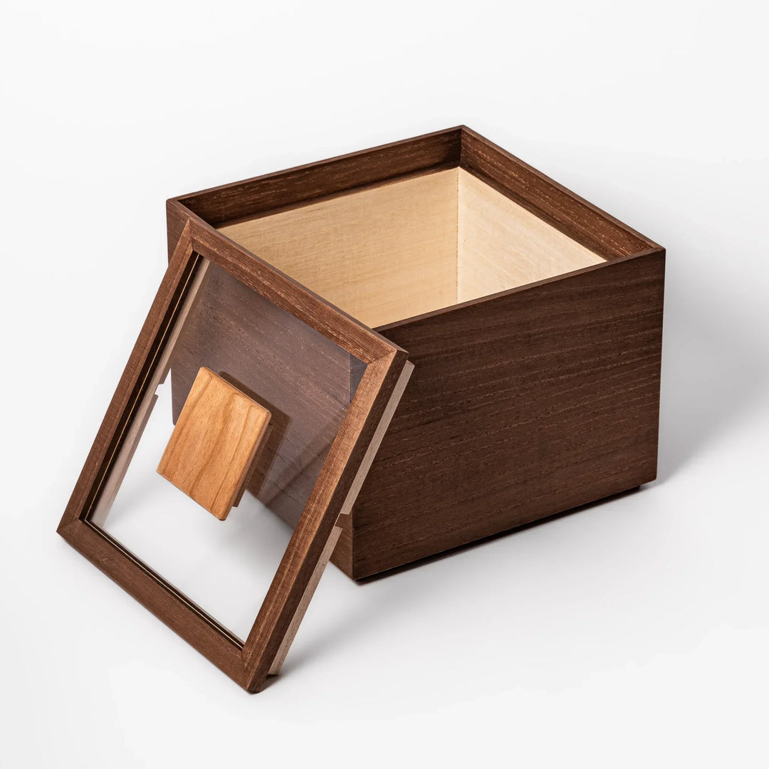 Dark brown paulownia wood rice container with airtight lid handcrafted in Japan for storing up to 3 kg rice.
