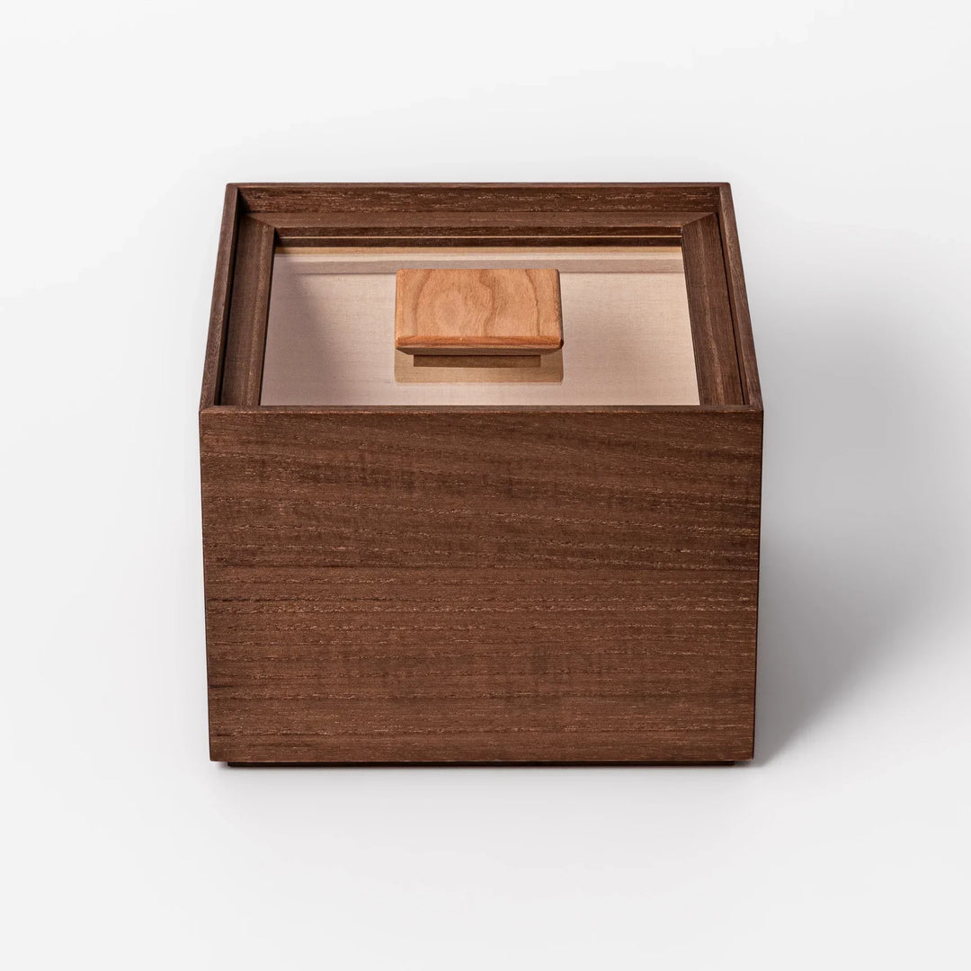 Dark brown paulownia wood rice container with airtight lid handcrafted in Japan for storing up to 3 kg rice.