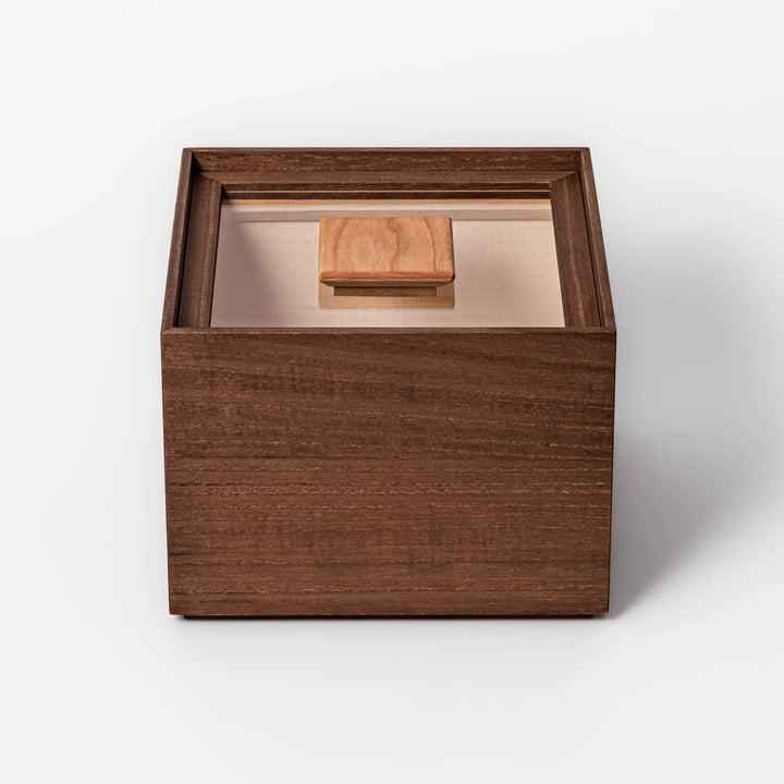 Dark brown paulownia wood rice container with airtight lid handcrafted in Japan for storing up to 3 kg rice.