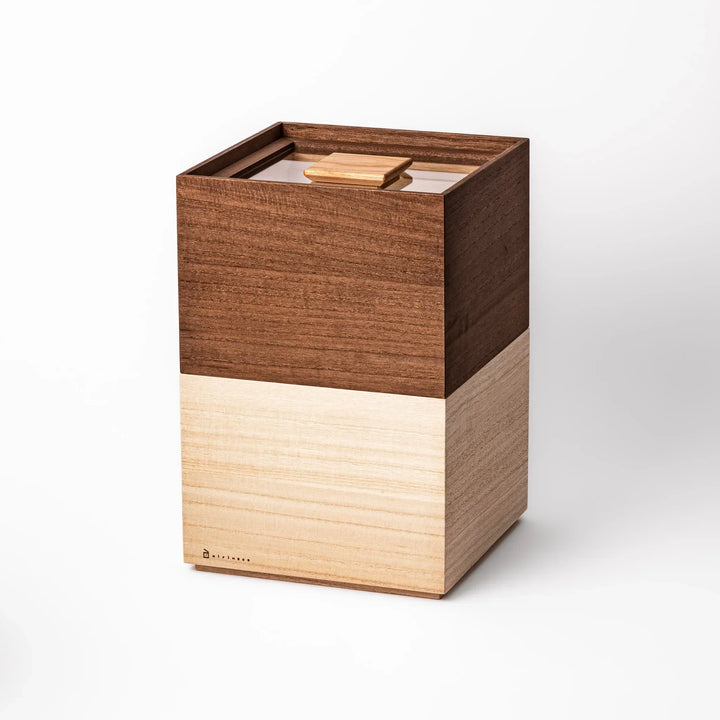 Stackable paulownia wood rice containers in brown and natural finish handcrafted in Japan for fresh storage.