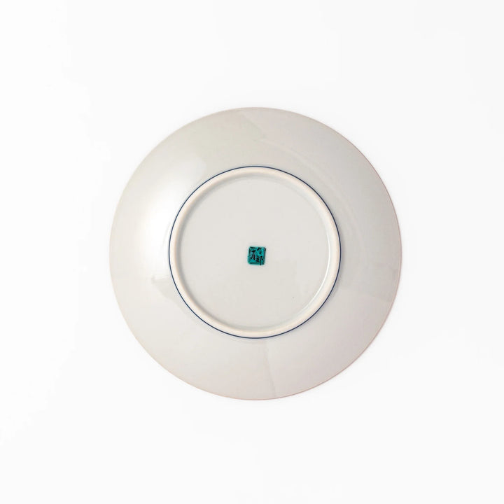 Japanese porcelain dessert plate with yellow patterned background gourd center blue pine and green leaves.