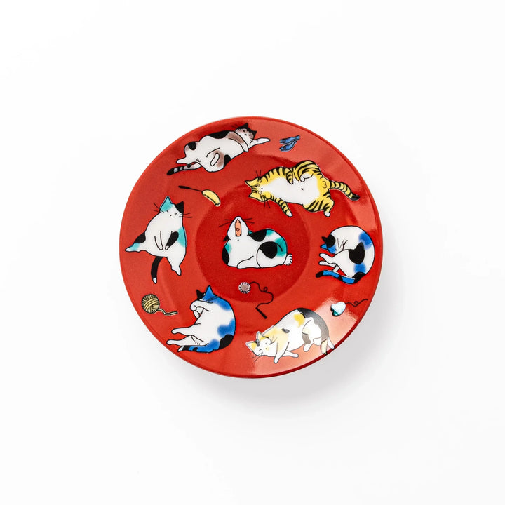Red Japanese porcelain sauce dish featuring playful cat illustrations in various poses, perfect for soy sauce or dipping.