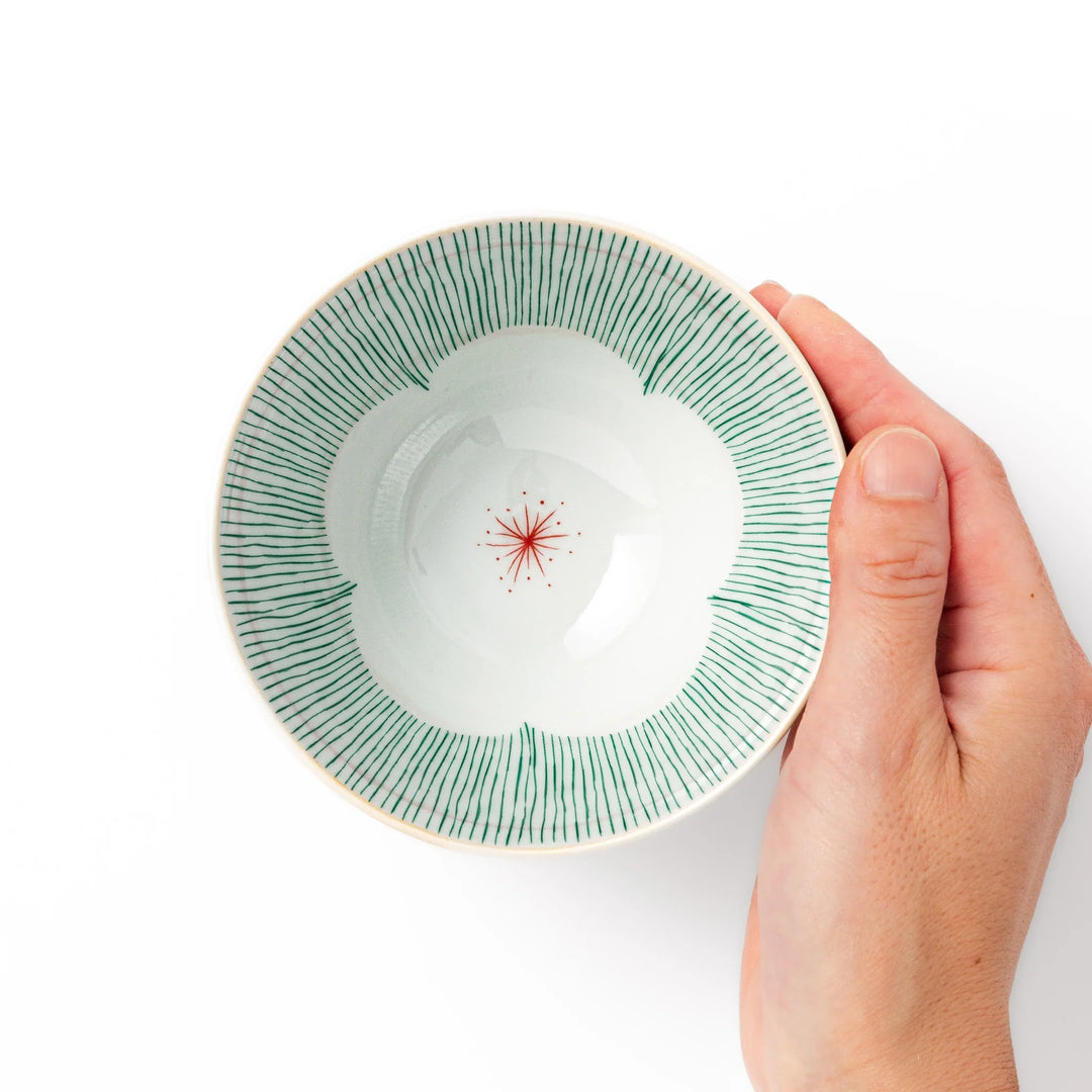 Japanese ceramic rice bowl with plum petal stripe design blending modern elegance with traditional style.