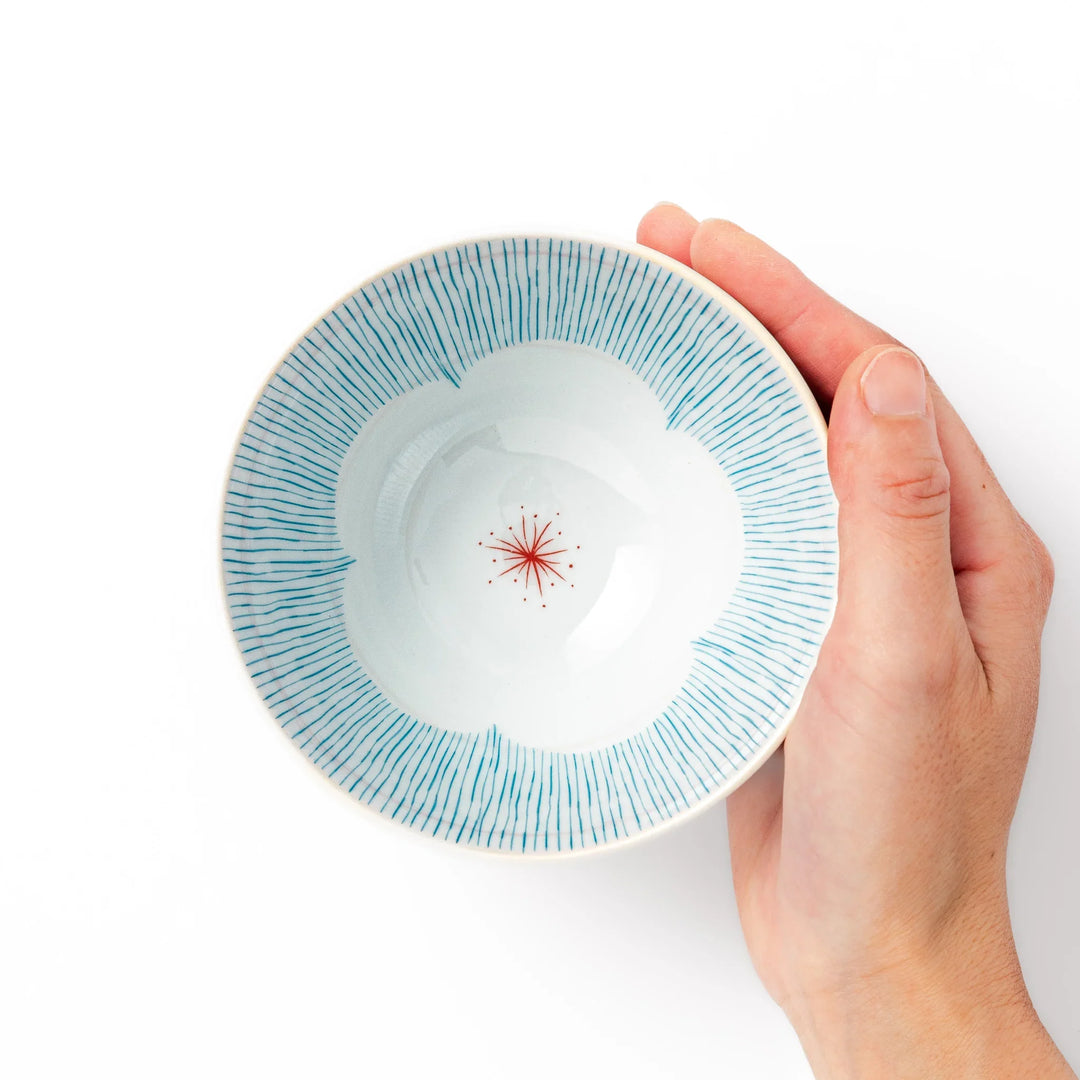 Japanese ceramic rice bowl with plum petal stripe design blending modern elegance with traditional style.