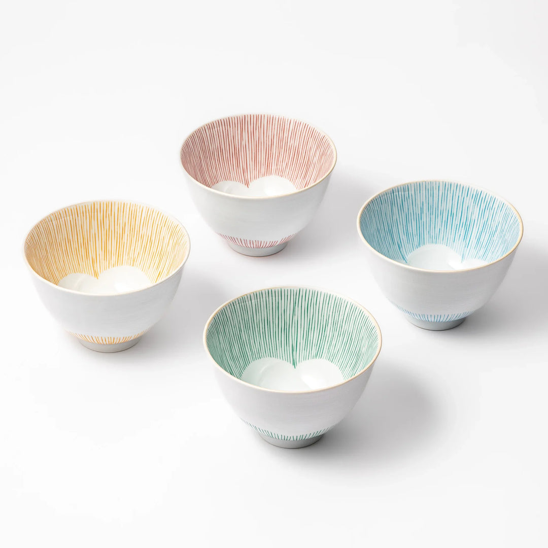 Set of four Japanese ceramic rice bowls with plum petal stripe design in red blue green and orange.