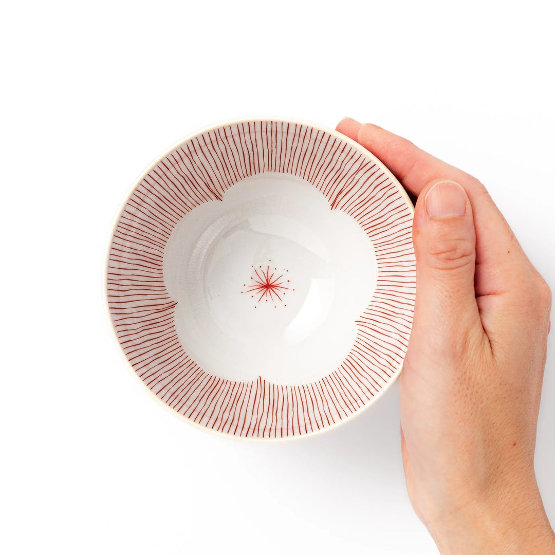 Japanese ceramic rice bowl with plum petal stripe design blending modern elegance with traditional style.