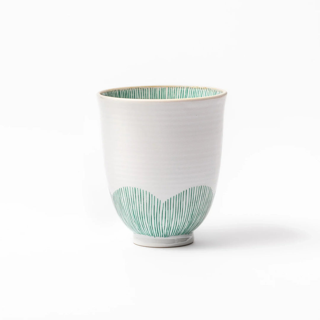 Japanese ceramic tea cup with plum petal stripe design blending modern simplicity with traditional elegance.