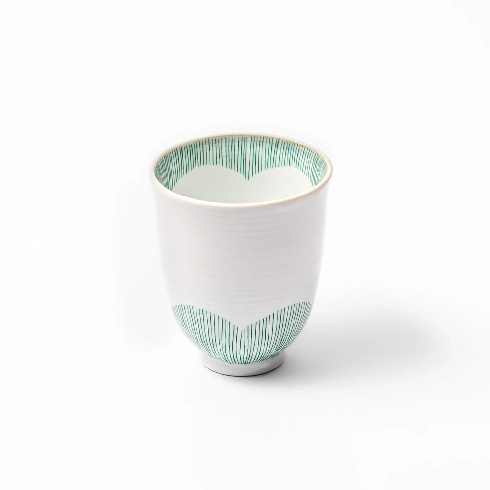 Japanese ceramic tea cup with plum petal stripe design blending modern simplicity with traditional elegance.