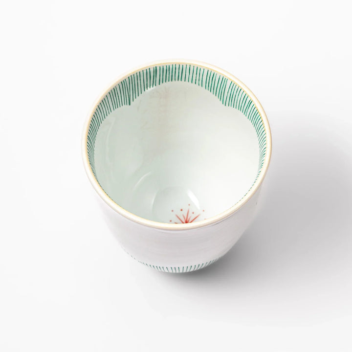 Japanese ceramic tea cup with plum petal stripe design blending modern simplicity with traditional elegance.