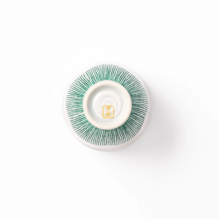 Japanese ceramic tea cup with plum petal stripe design blending modern simplicity with traditional elegance.