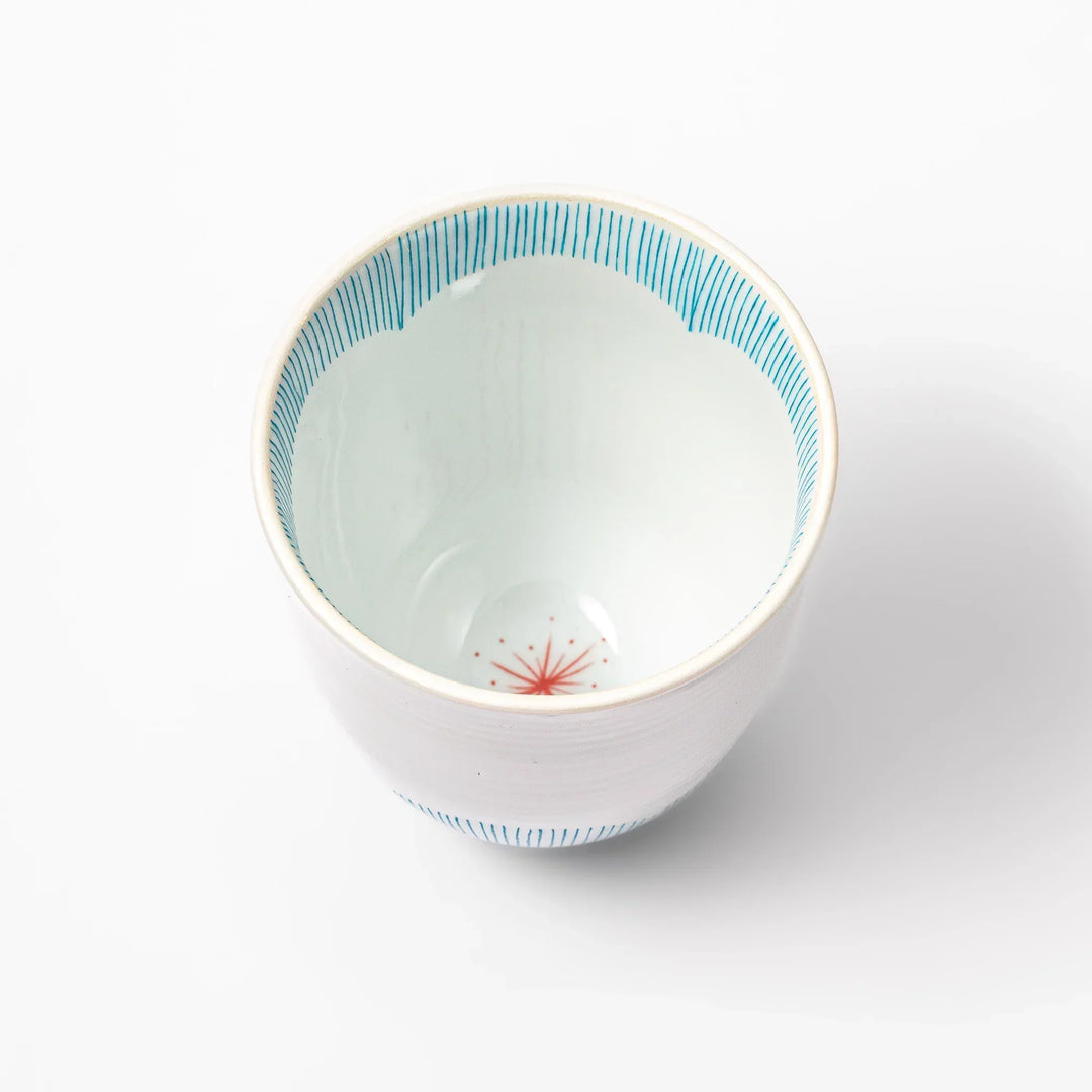 Japanese ceramic tea cup with plum petal stripe design in blue, showcasing minimalist elegance and traditional Japanese craft