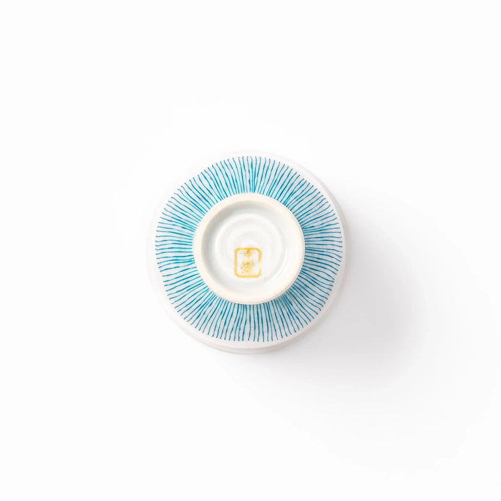 Japanese ceramic tea cup with plum petal stripe design in blue, showcasing minimalist elegance and traditional Japanese craft