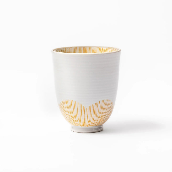 Japanese ceramic tea cup with plum petal stripe design in orange, combining modern minimalism and traditional Japanese style