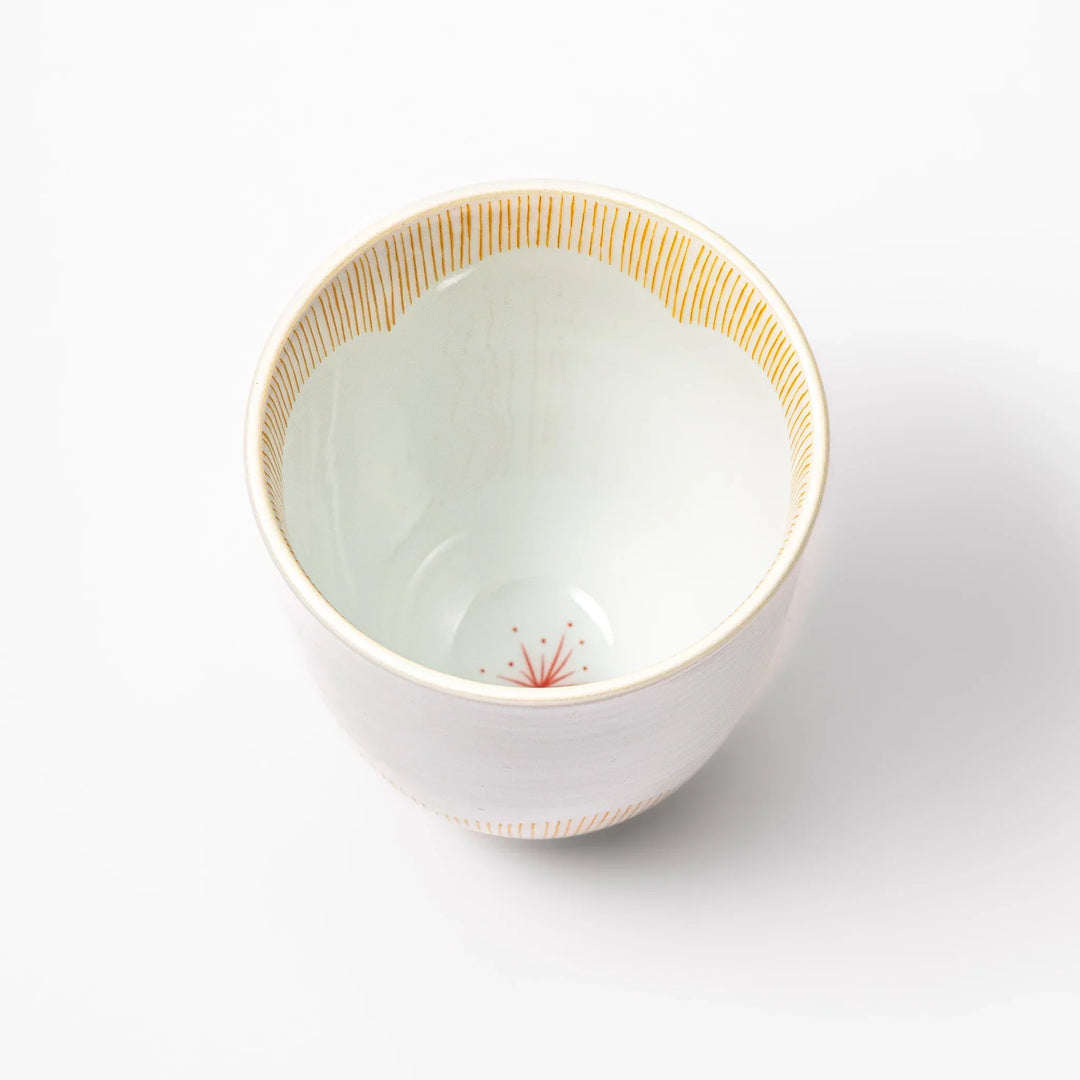 Japanese ceramic tea cup with plum petal stripe design in orange, combining modern minimalism and traditional Japanese style