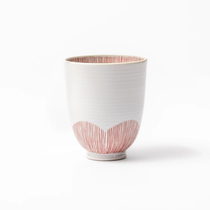 Japanese ceramic tea cup with plum petal stripe design in red, combining traditional elegance and modern simplicity