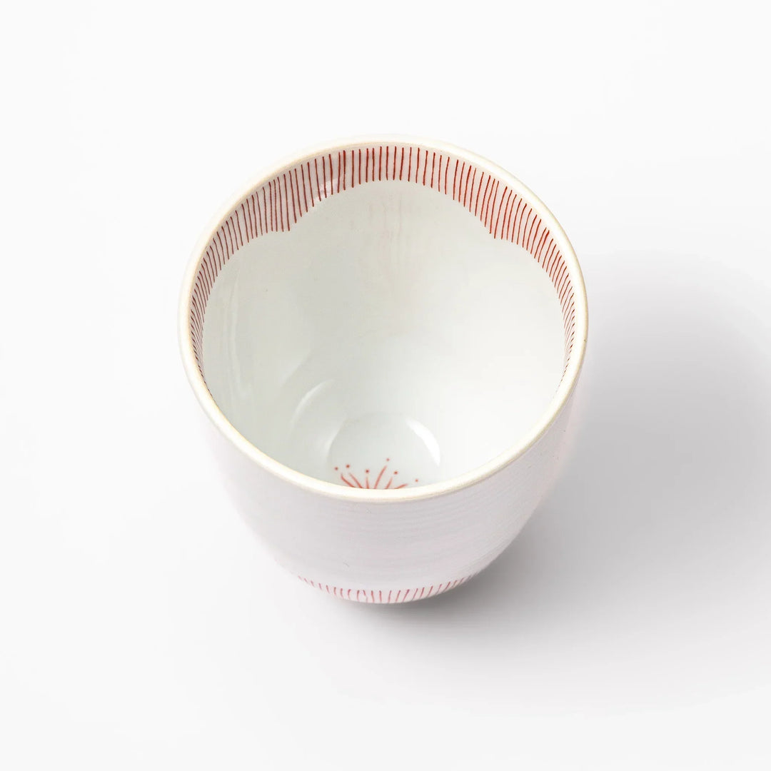 Japanese ceramic tea cup with plum petal stripe design in red, combining traditional elegance and modern simplicity