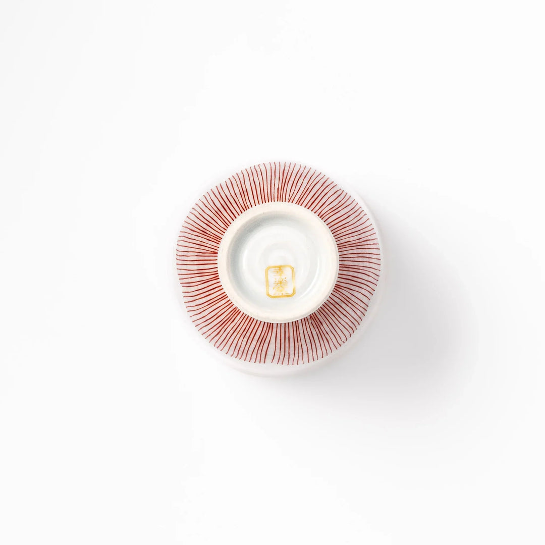 Japanese ceramic tea cup with plum petal stripe design in red, combining traditional elegance and modern simplicity