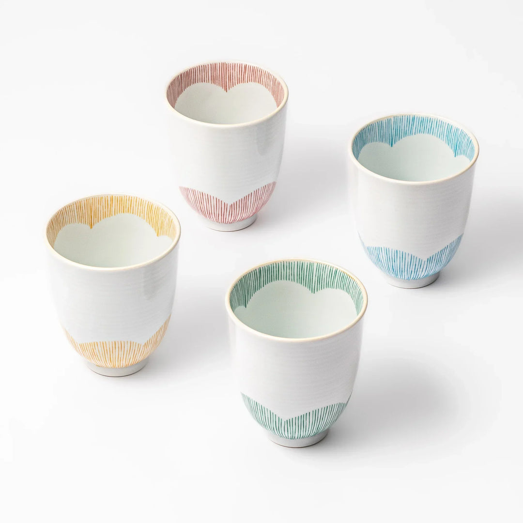 Set of Japanese ceramic tea cups with plum petal stripe design perfect for daily tea rituals and gatherings.