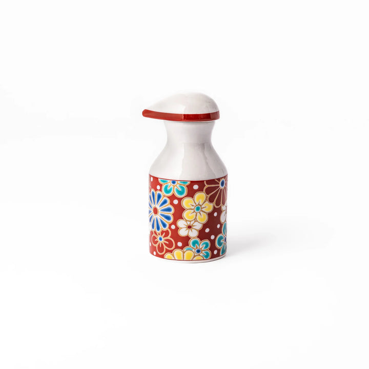 Japanese ceramic soy sauce dispenser with red lid and plum and chrysanthemum blossoms handcrafted in Arita.