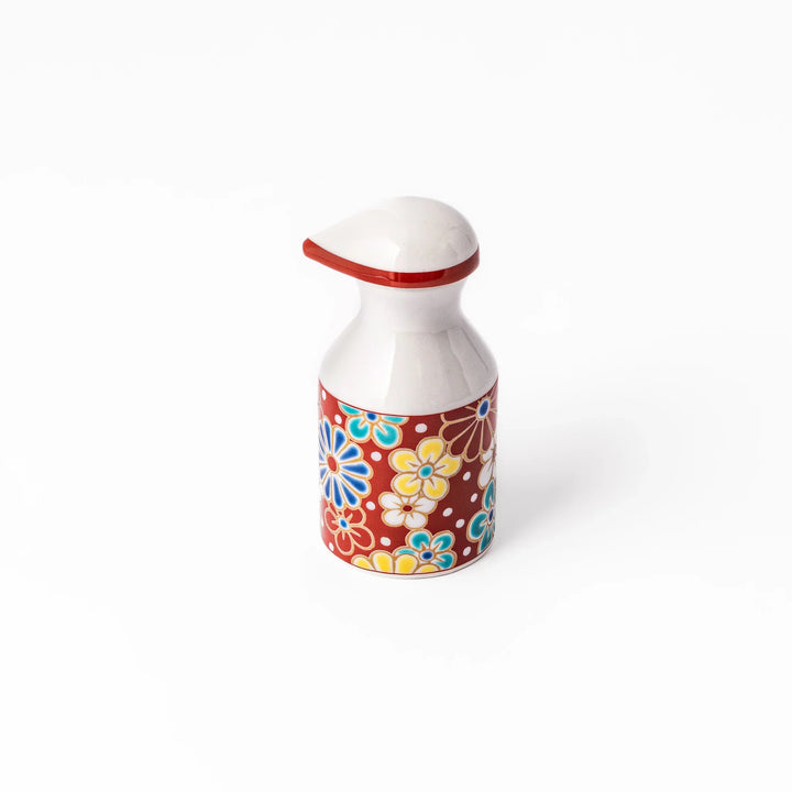 Japanese ceramic soy sauce dispenser with red lid and plum and chrysanthemum blossoms handcrafted in Arita.