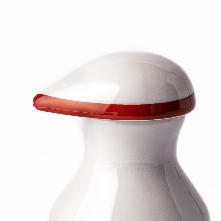 Japanese ceramic soy sauce dispenser with red lid and plum and chrysanthemum blossoms handcrafted in Arita.