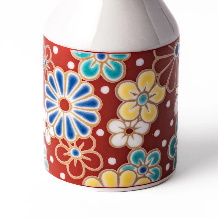 Japanese ceramic soy sauce dispenser with red lid and plum and chrysanthemum blossoms handcrafted in Arita.