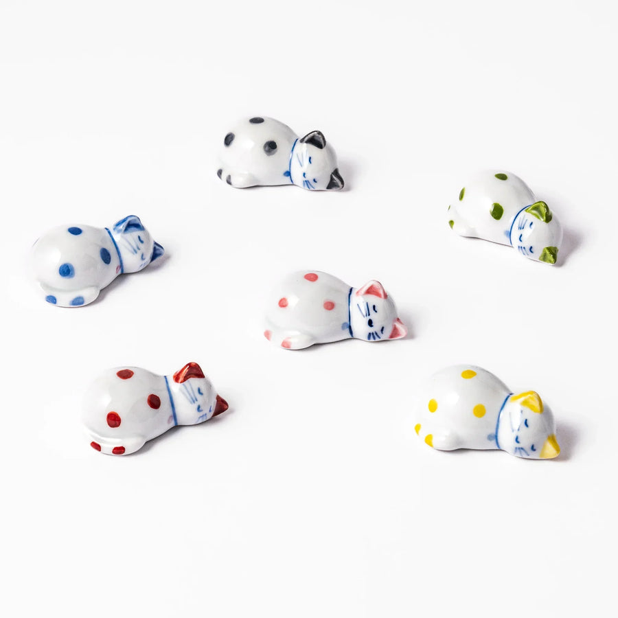 Set of colorful polka dot cat shaped ceramic chopstick rests adding playful charm to Japanese tableware.