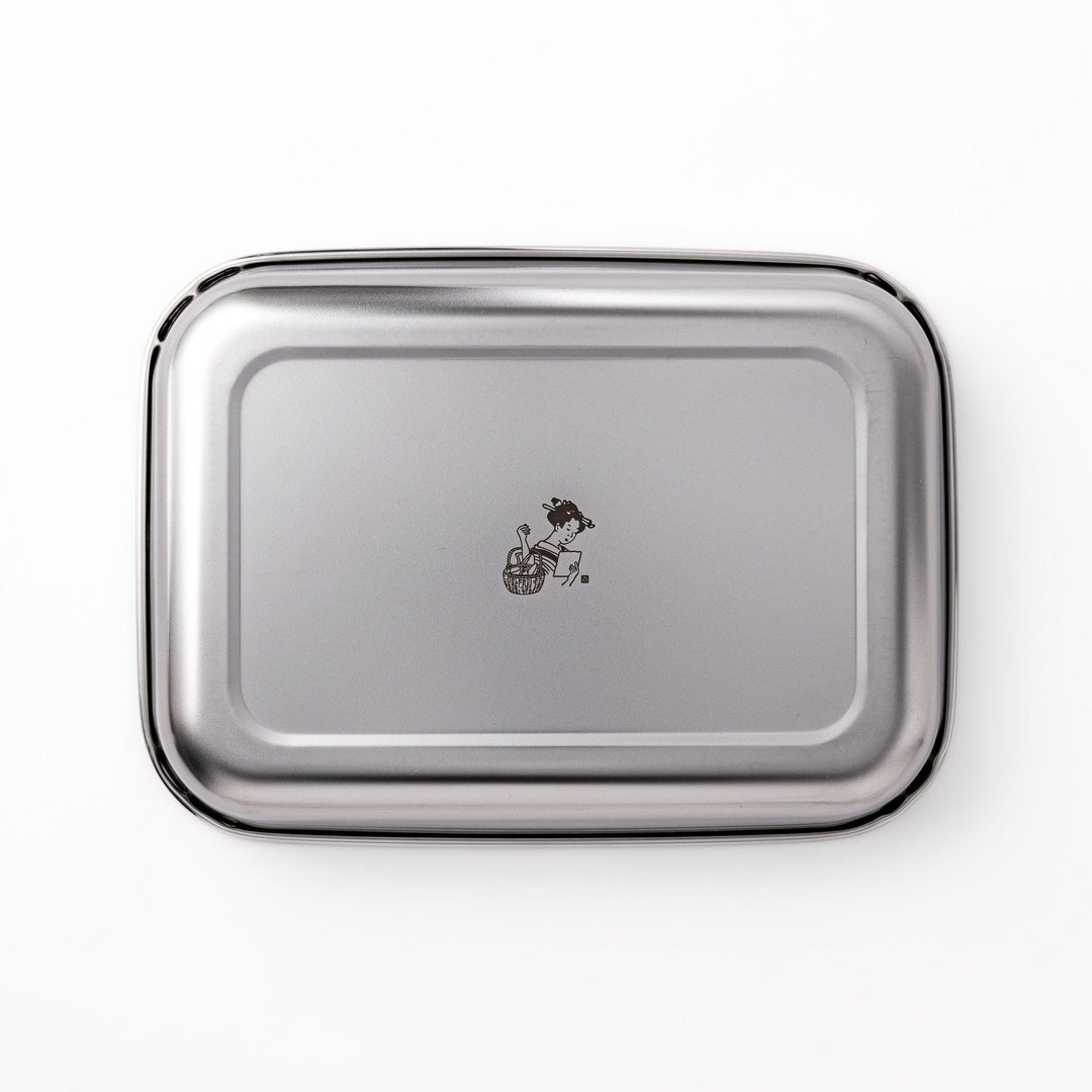 Stainless steel prep tray with engraved woman illustration blending Japanese design and kitchen function.